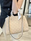Louis Vuitton Montaigne BB Dune Empreinte Leather Top Handle Bag